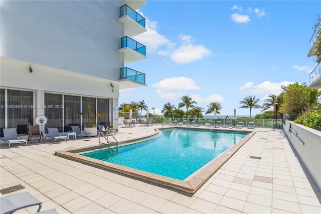 9511 Collins Ave Unit 806, Surfside, FL 33154 - community pool with fence and a patio area