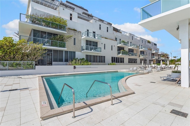9511 Collins Ave Unit 806, Surfside, FL 33154 - community pool featuring a patio