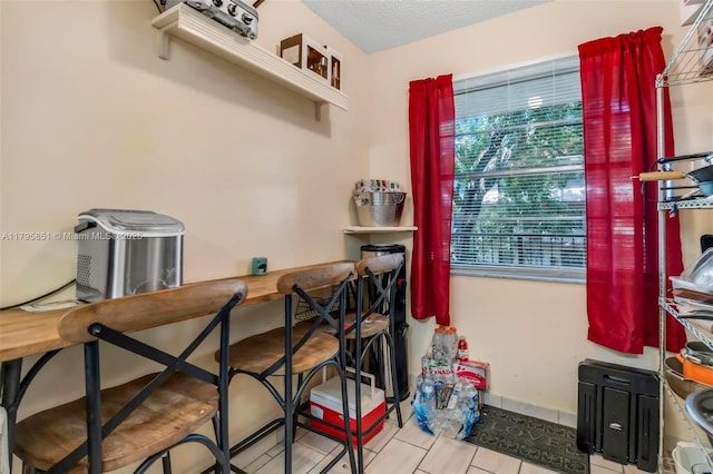 dining area with tile patterned floors