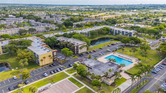 aerial view of a nearby body of water and a pool