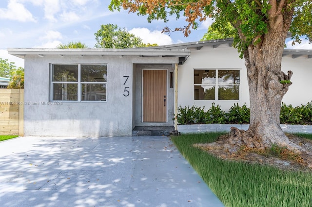 75 NW 125th St, North Miami, FL 33168 - bungalow-style home featuring stucco siding