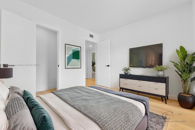 75 NW 125th St, North Miami, FL 33168 - bedroom featuring light wood-style floors and baseboards