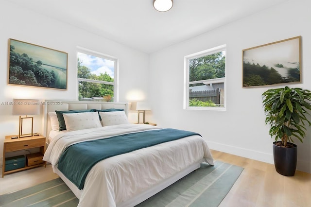 75 NW 125th St, North Miami, FL 33168 - bedroom featuring wood finished floors and baseboards