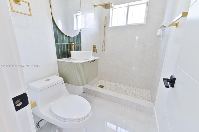 75 NW 125th St, North Miami, FL 33168 - full bath featuring a sink, a tile shower, and toilet