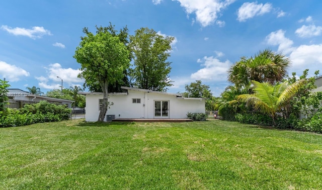 75 NW 125th St, North Miami, FL 33168 - back of house featuring stucco siding and a deck