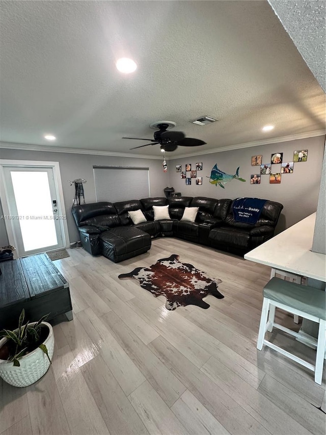 12821 SW 10th Ct, Davie, FL 33325 - living area with crown molding, a textured ceiling, ceiling fan, wood finished floors, and recessed lighting