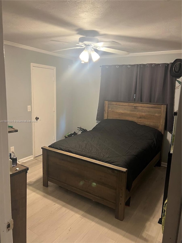 12821 SW 10th Ct, Davie, FL 33325 - bedroom with a textured ceiling, light wood finished floors, crown molding, and ceiling fan