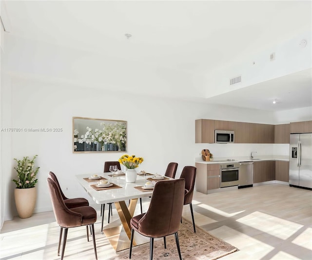 1600 SW 1st Ave Unit Th-07, Miami, FL 33129 - dining area with light wood-style flooring
