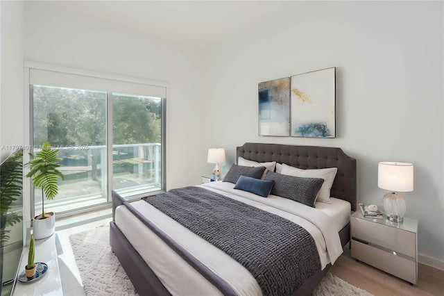 1600 SW 1st Ave Unit Th-07, Miami, FL 33129 - bedroom featuring access to outside, wood finished floors, and baseboards