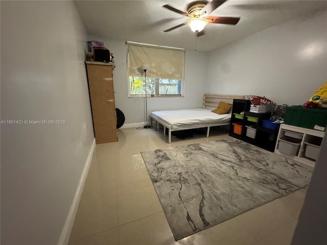 4360 NW 79th Ave Unit 1F, Doral, FL 33166 - tiled bedroom with a ceiling fan and baseboards