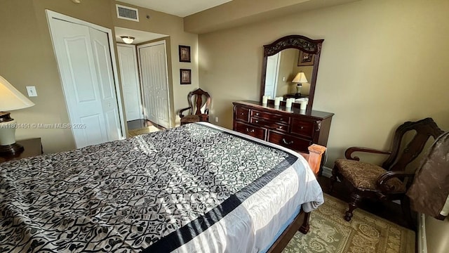 2665 SW 37th Ave Unit 1112, Miami, FL 33133 - bedroom with wood finished floors, a closet, and baseboards