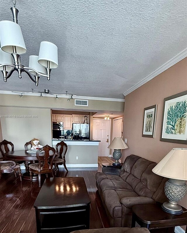 2665 SW 37th Ave Unit 1112, Miami, FL 33133 - living room with dark wood finished floors, ornamental molding, and a textured ceiling
