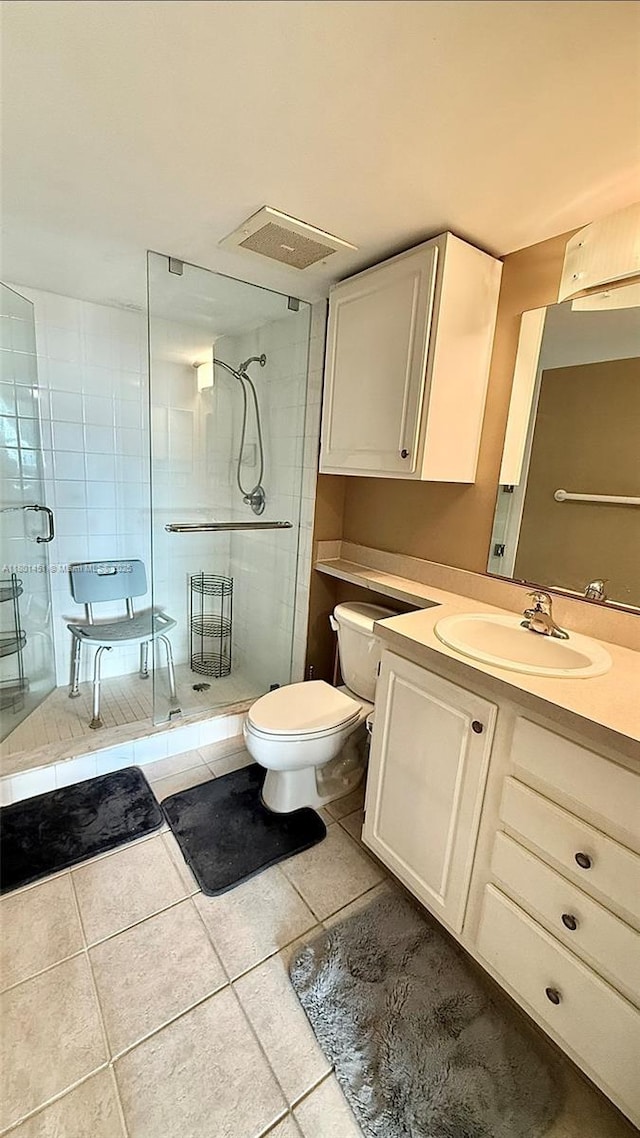 2665 SW 37th Ave Unit 1112, Miami, FL 33133 - bathroom featuring tile patterned flooring, toilet, a shower stall, and vanity