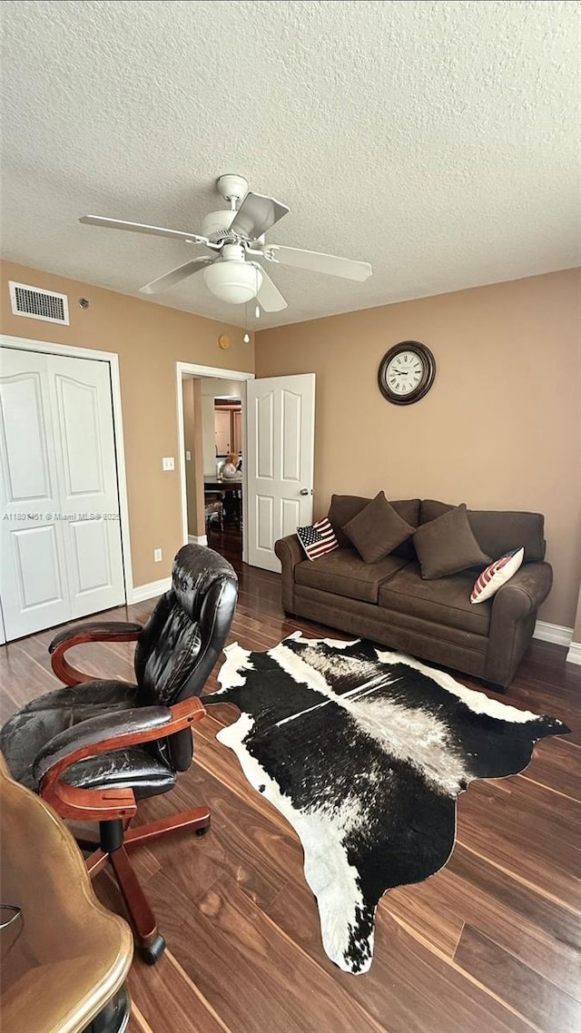 2665 SW 37th Ave Unit 1112, Miami, FL 33133 - living area with a textured ceiling, ceiling fan, wood finished floors, and baseboards