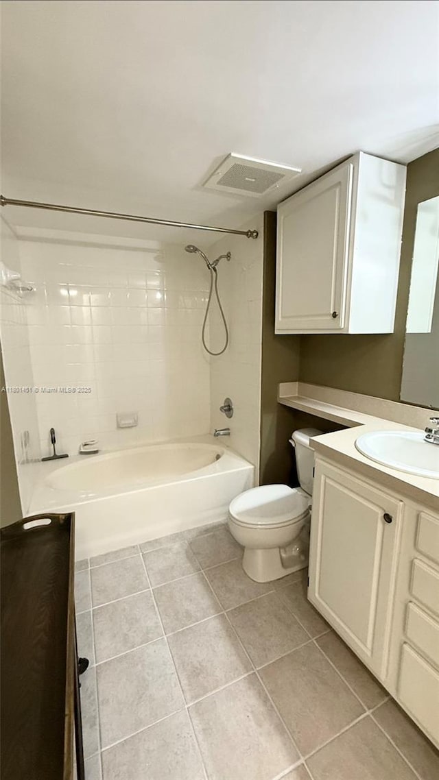 2665 SW 37th Ave Unit 1112, Miami, FL 33133 - bathroom with washtub / shower combination, toilet, vanity, and tile patterned floors