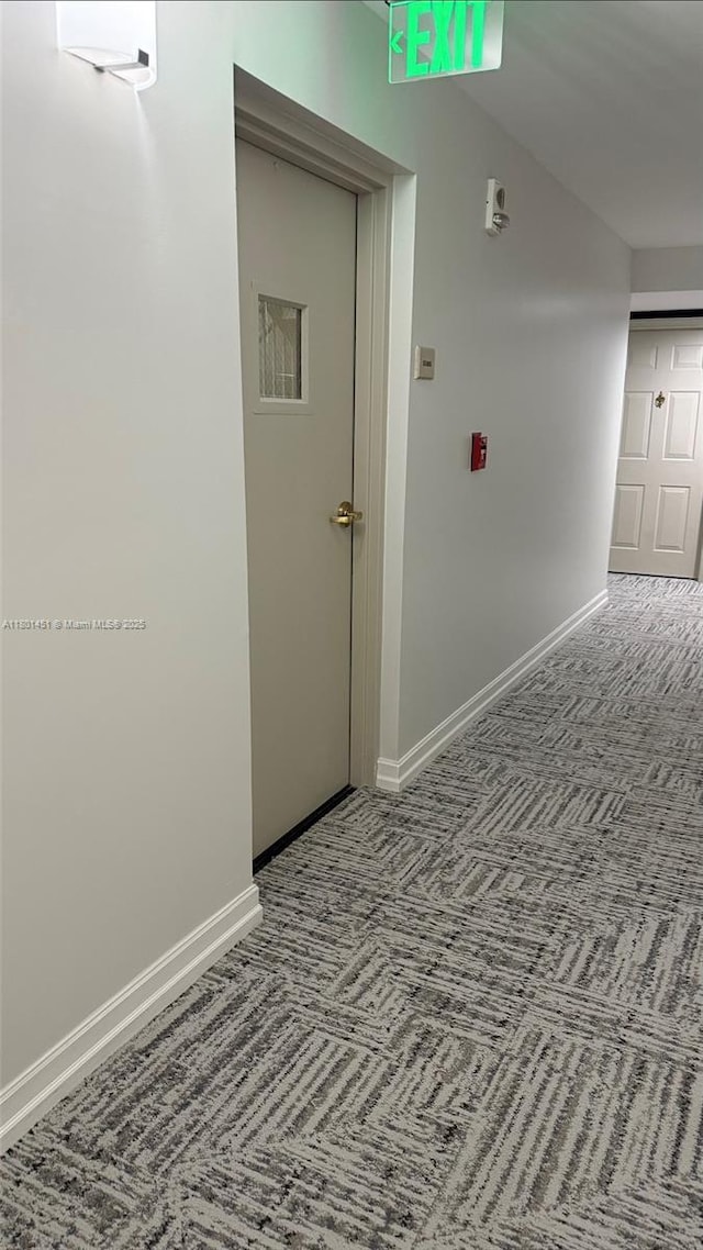 2665 SW 37th Ave Unit 1112, Miami, FL 33133 - hallway with carpet and baseboards