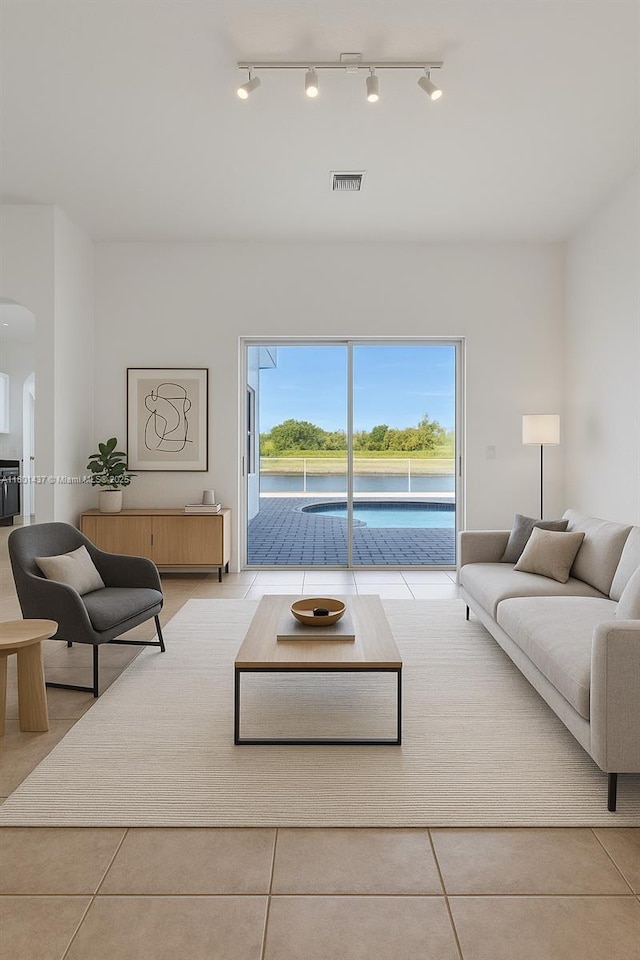 3360 SW 195th Ter, Miramar, FL 33029 - living area with arched walkways, tile patterned floors, and rail lighting