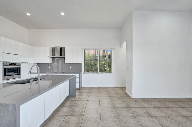 3360 SW 195th Ter, Miramar, FL 33029 - kitchen featuring stainless steel oven, wall chimney range hood, modern cabinets, a sink, and white cabinets