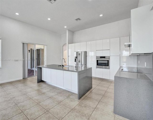 3360 SW 195th Ter, Miramar, FL 33029 - kitchen featuring stainless steel appliances, light tile patterned floors, white cabinets, modern cabinets, and a sink