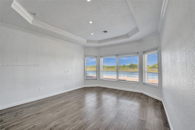 3360 SW 195th Ter, Miramar, FL 33029 - empty room with ornamental molding, a raised ceiling, a textured wall, dark wood-style floors, and a textured ceiling
