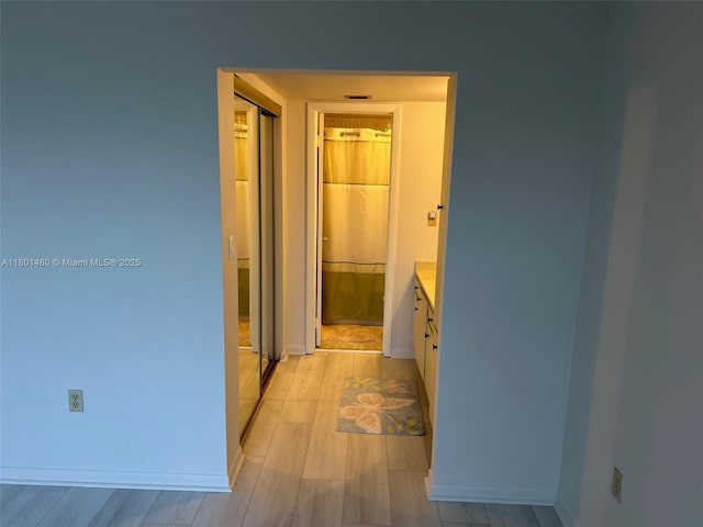 1000 Colony Point Cir Unit 302, Pembroke Pines, FL 33026 - hall with baseboards and light wood-style flooring