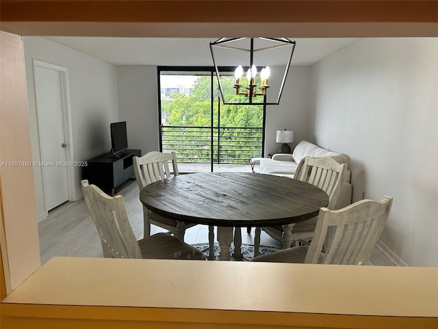 1000 Colony Point Cir Unit 302, Pembroke Pines, FL 33026 - dining space featuring a chandelier and light wood-style flooring