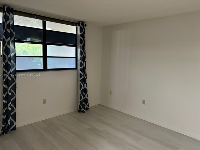 1000 Colony Point Cir Unit 302, Pembroke Pines, FL 33026 - unfurnished room with wood finished floors