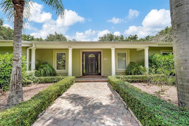6551 SW 126th St, Pinecrest, FL 33156 - property entrance featuring stucco siding and a porch