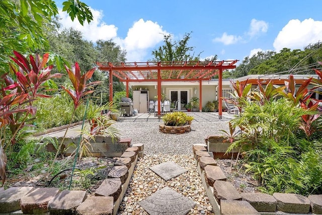 6551 SW 126th St, Pinecrest, FL 33156 - rear view of property with french doors, a pergola, and a patio area