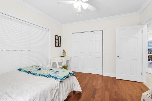 6551 SW 126th St, Pinecrest, FL 33156 - bedroom with ornamental molding, wood finished floors, a closet, a ceiling fan, and baseboards