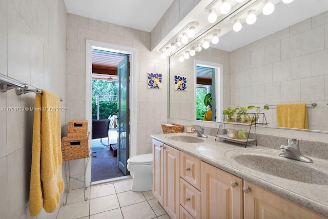 6551 SW 126th St, Pinecrest, FL 33156 - full bath featuring tile walls, tile patterned floors, toilet, and double vanity