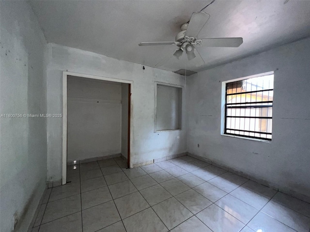 3035 NW 100th St, Miami, FL 33147 - unfurnished bedroom featuring tile patterned floors and ceiling fan