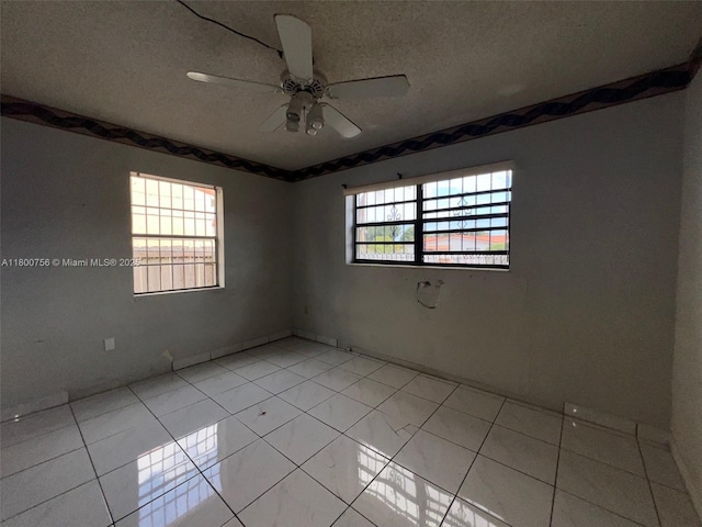 3035 NW 100th St, Miami, FL 33147 - unfurnished room featuring a textured ceiling and ceiling fan