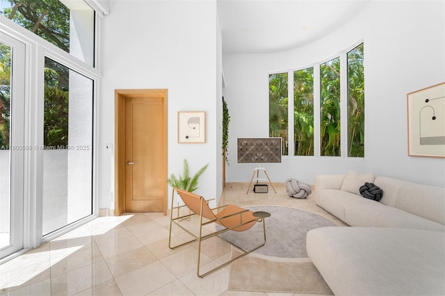 9500 SW 60th Ct, Pinecrest, FL 33156 - living room with healthy amount of natural light, light tile patterned floors, and a high ceiling