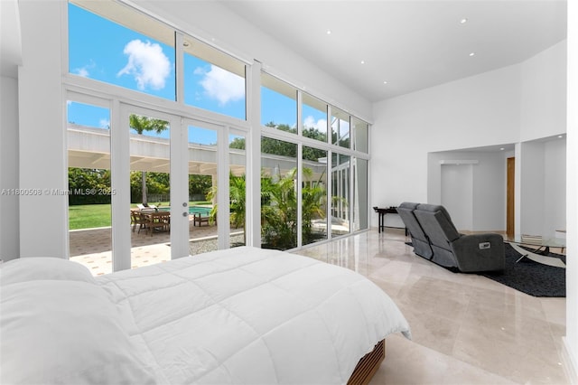 9500 SW 60th Ct, Pinecrest, FL 33156 - bedroom featuring a towering ceiling, recessed lighting, marble tiled flooring, and access to exterior