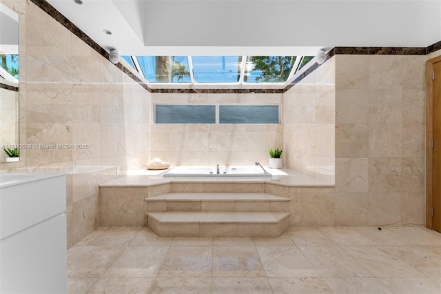 9500 SW 60th Ct, Pinecrest, FL 33156 - full bath featuring a skylight, tile walls, a bath, and vanity
