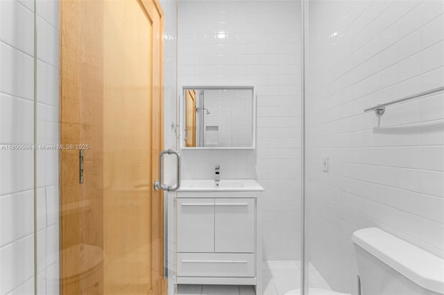 9500 SW 60th Ct, Pinecrest, FL 33156 - full bath with tile walls, toilet, a stall shower, and vanity
