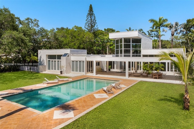 9500 SW 60th Ct, Pinecrest, FL 33156 - rear view of house featuring a patio, a yard, and stucco siding