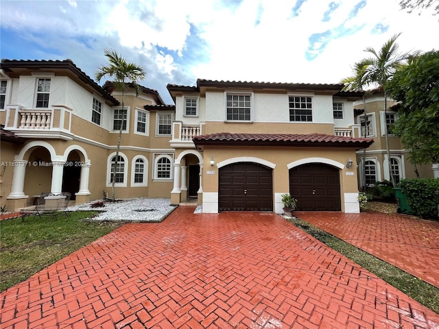 12708 SW 49th Dr, Miramar, FL 33027 - mediterranean / spanish-style house with stucco siding, driveway, a garage, and a balcony