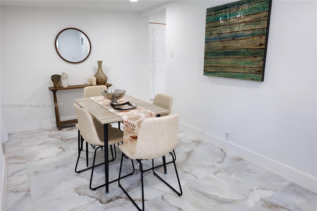 1649 NE 8th Ave, Fort Lauderdale, FL 33305 - dining space with light marble finish flooring and baseboards
