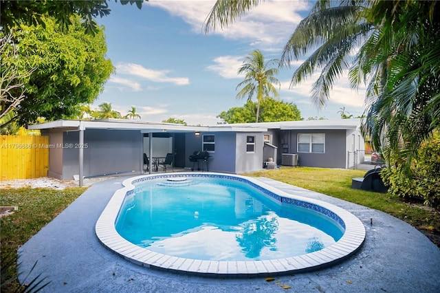1649 NE 8th Ave, Fort Lauderdale, FL 33305 - outdoor pool featuring grilling area, central AC unit, and a patio area