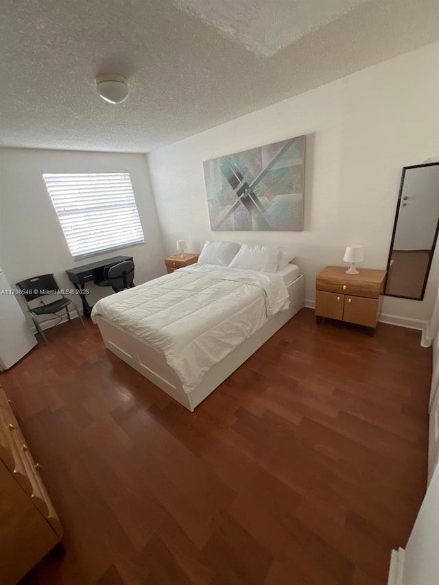 4632 NW 97th Pl Unit 262, Doral, FL 33178 - bedroom featuring wood finished floors and a textured ceiling