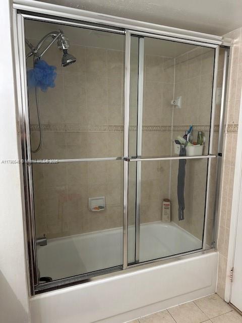 4632 NW 97th Pl Unit 262, Doral, FL 33178 - full bath featuring tile patterned floors and combined bath / shower with glass door