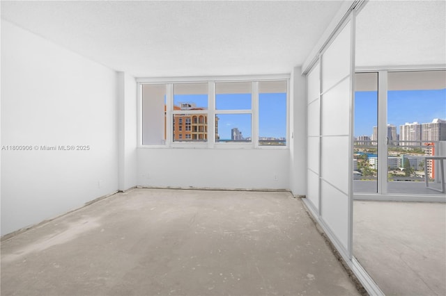 2030 S Ocean Dr Unit 1708, Hallandale Beach, FL 33009 - unfurnished room featuring a view of city, healthy amount of natural light, and unfinished concrete floors