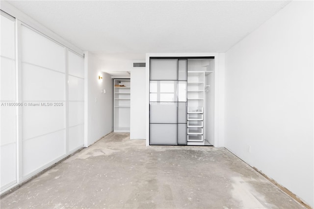 2030 S Ocean Dr Unit 1708, Hallandale Beach, FL 33009 - unfurnished bedroom featuring concrete flooring and multiple closets