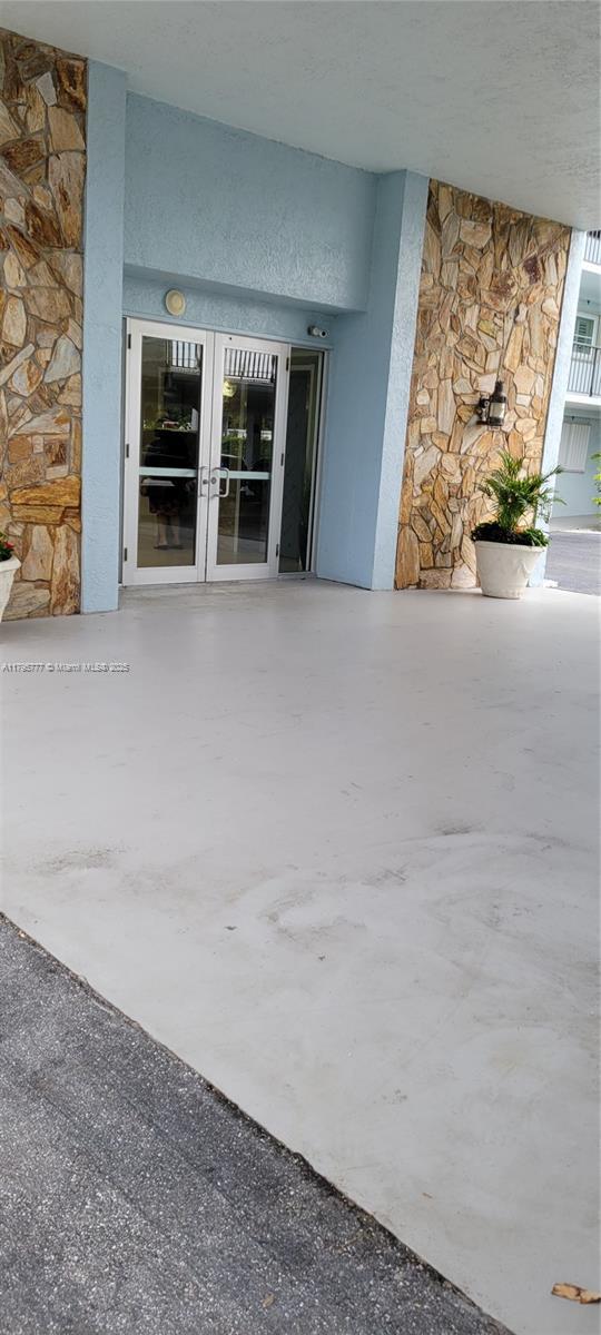 3040 Lake Shore Dr, Riviera Beach, FL 33404 - property entrance with french doors