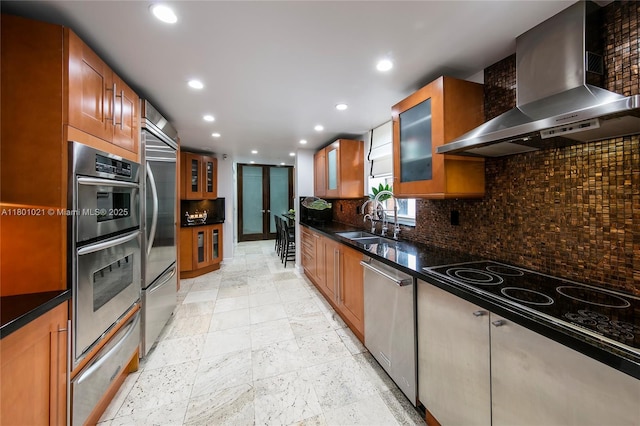 1530 NE Quayside Ter Unit A1, Miami, FL 33138 - kitchen featuring wall chimney range hood, stainless steel appliances, a warming drawer, tasteful backsplash, and recessed lighting