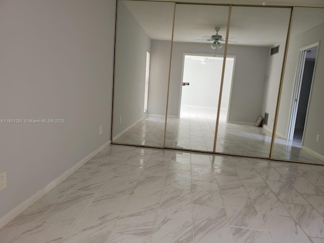 637 Executive Center Dr Unit N102, West Palm Beach, FL 33401 - spare room with a ceiling fan, marble finish floors, and baseboards