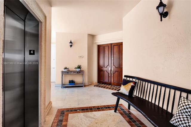 doorway to property featuring elevator
