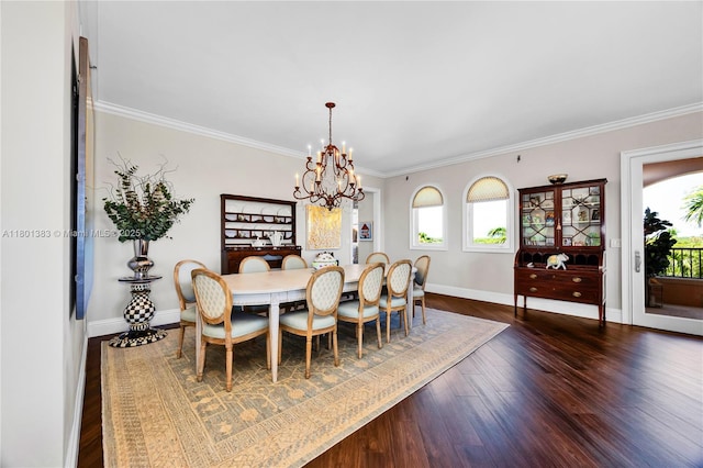 dining room with a chandelier, dark wood-style flooring, crown molding, and baseboards